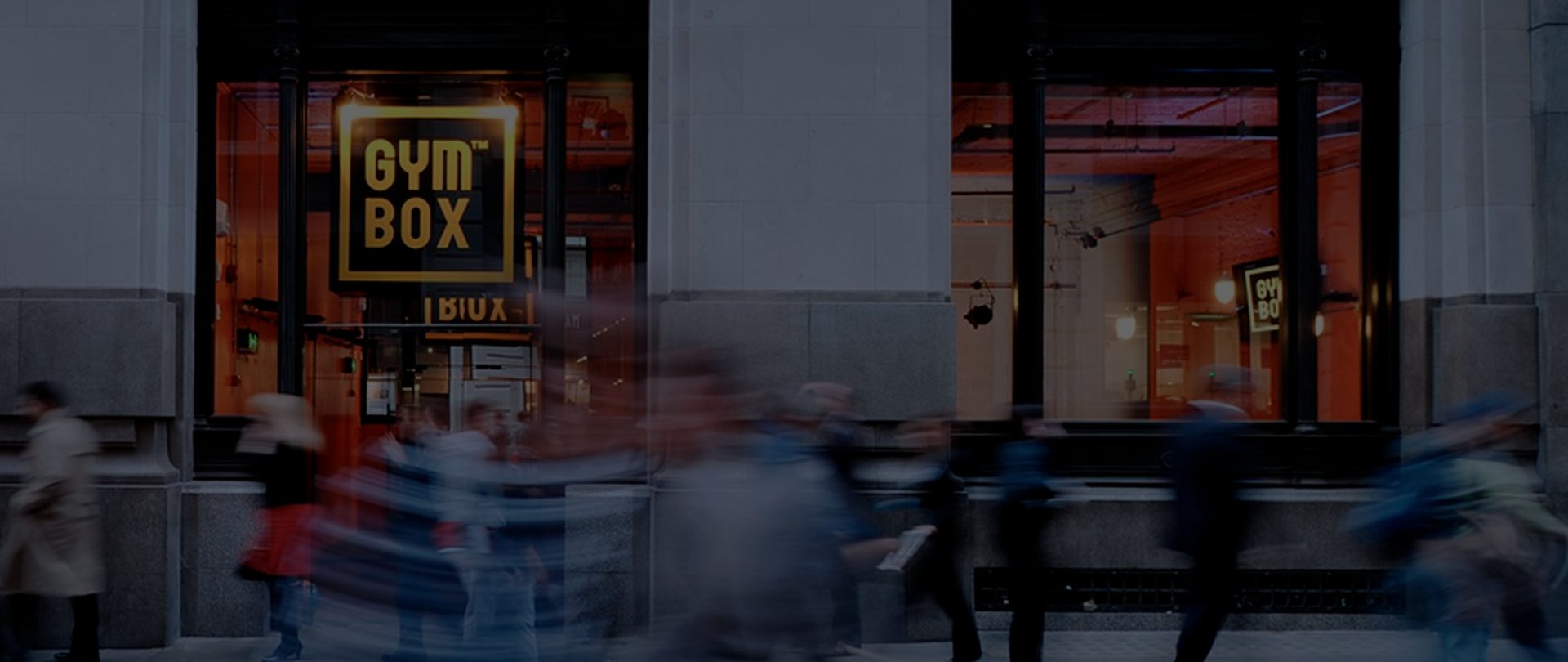 Image of the front of Gymbox Bank showing people walking past in a busy London scene