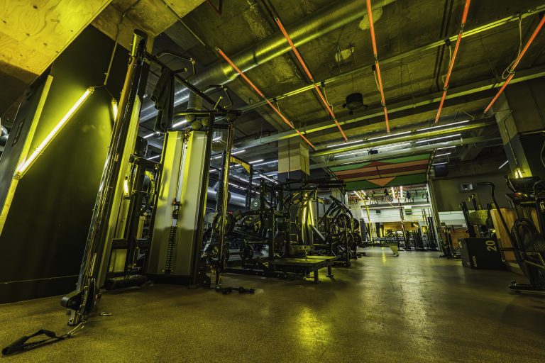 Gymbox Old St gym floor showing cable machines, resistance machines, functional and aerial studio and cardio
