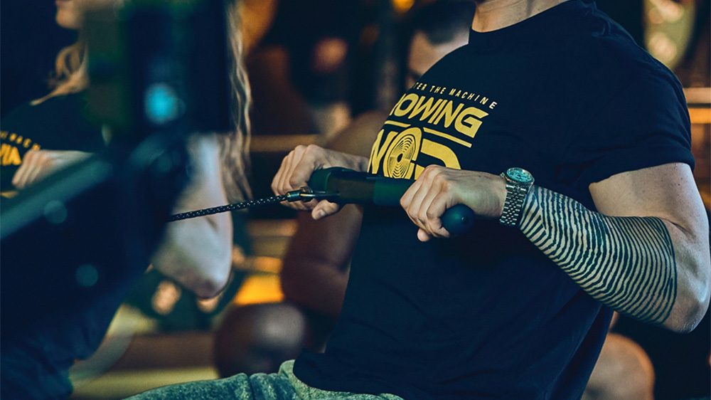 Rowingwod - person uses a rowing machine