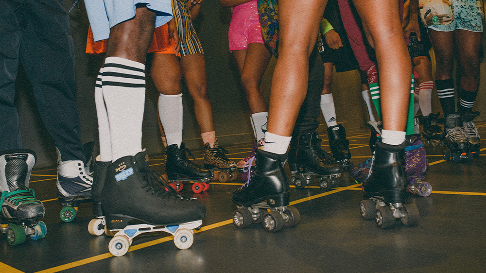 Watch my wheels - view of rollerblades and ankles