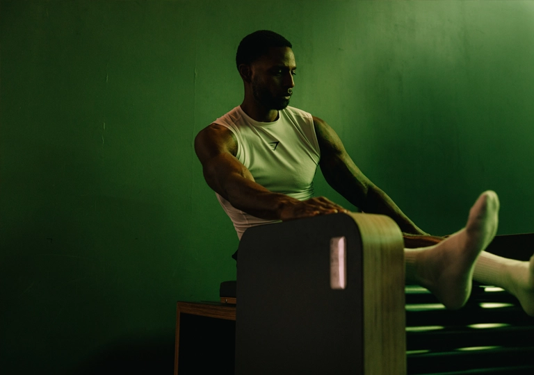 gymbox recovery, athlete uses fascial stimulator