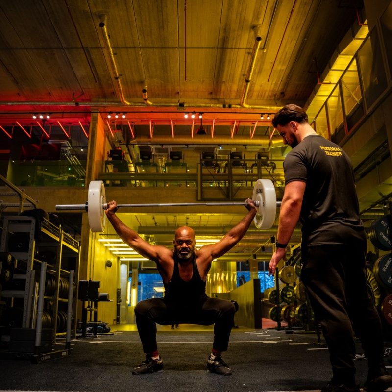 Personal Training at Gymbox Pt Olympic Lifting in Gymbox Elephant & Castle with nightclub light overhead